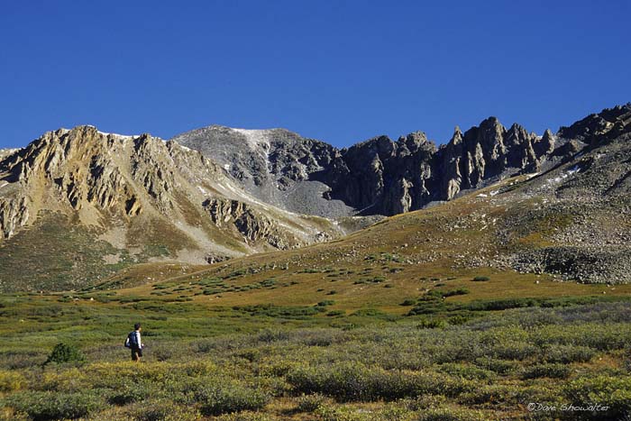 LaPlata Peak, 14,336' towers over a meadow as Marla contemplates the effort to climb this majestic mountain. Collegiate Peaks...